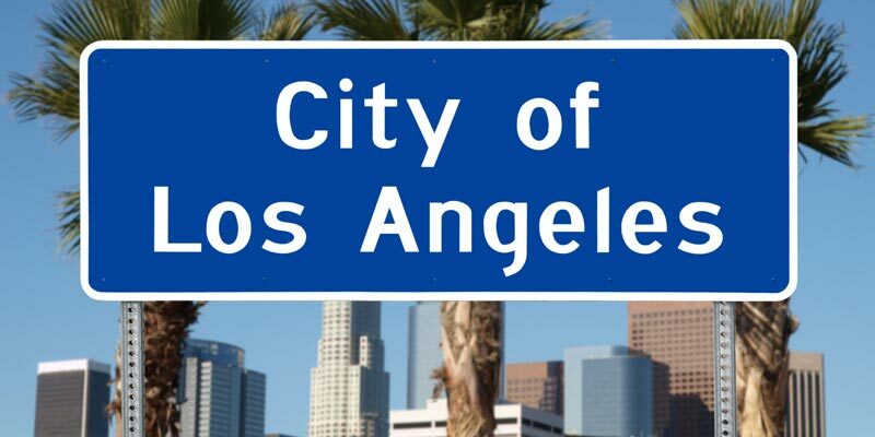 m-la-city-tour6-shutterstock_73098562-los-angeles-city-limit-sign-with-towers-and-palm-trees-8116531